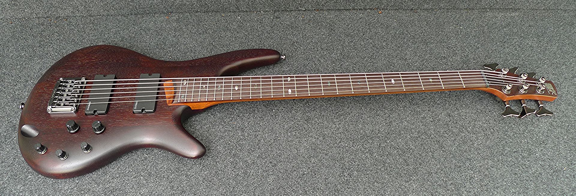 this bass is   factory 2nd (sold as used) and has   tiny ding on